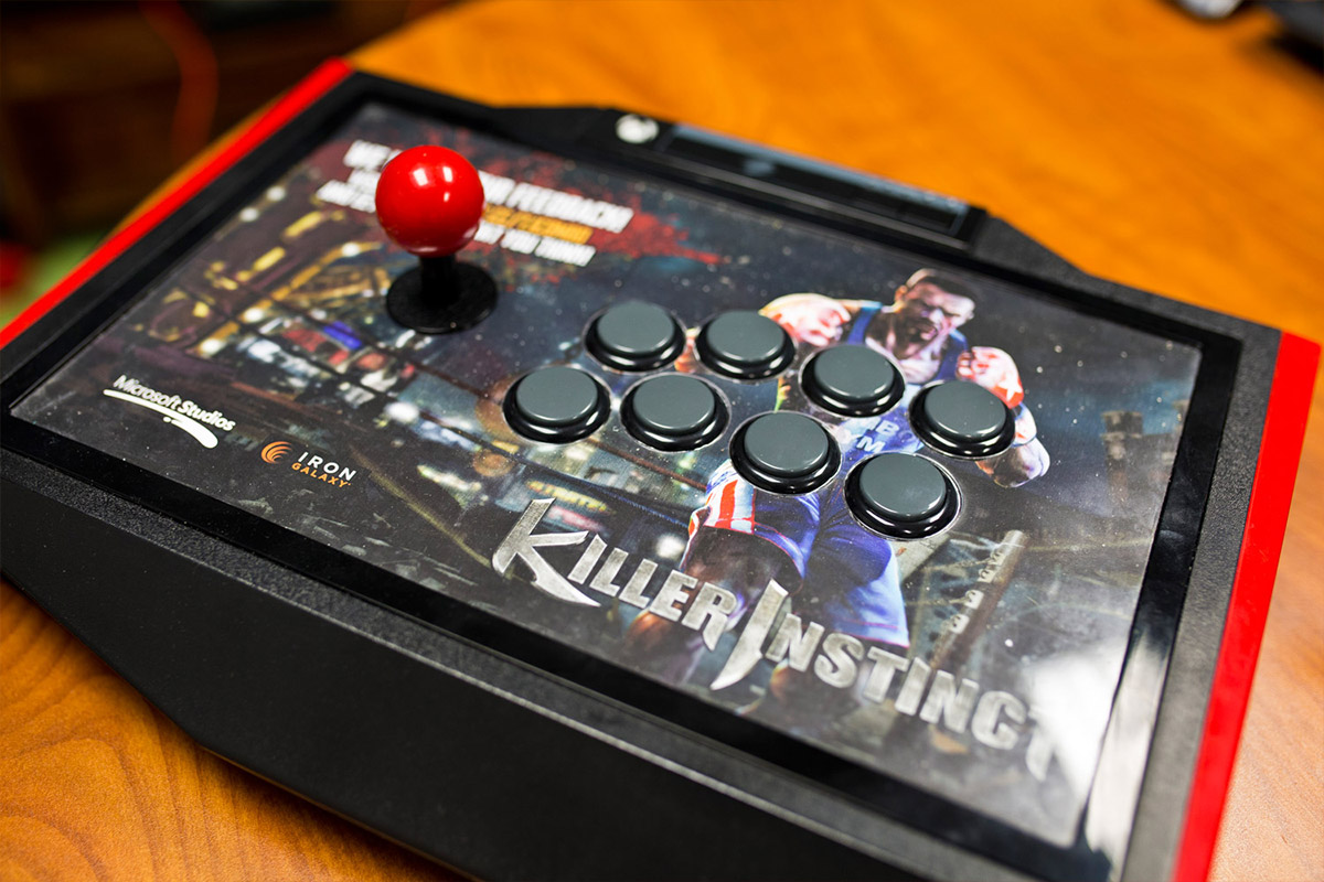 Close-up shot of videogame fighting joystick controller with Killer Instinct branding
