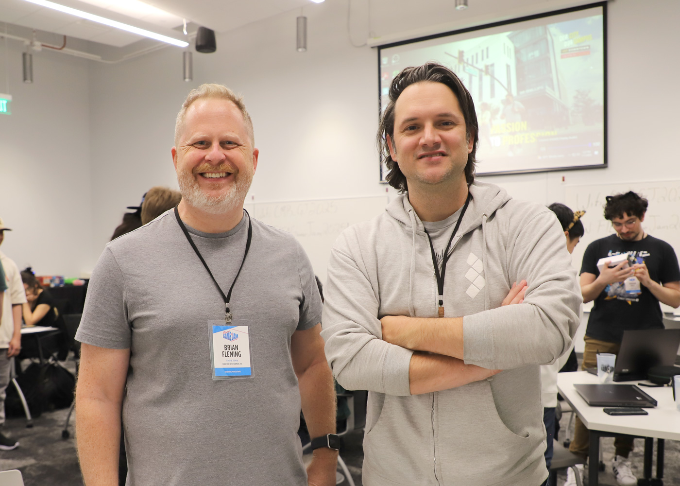 Group photo of two team members smiling