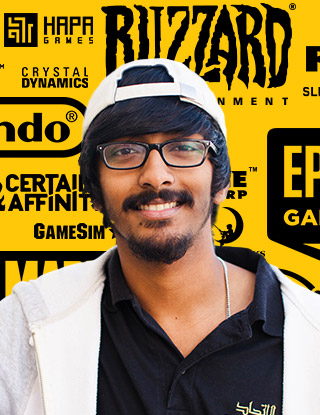 Male indian student standing infront of video game logos