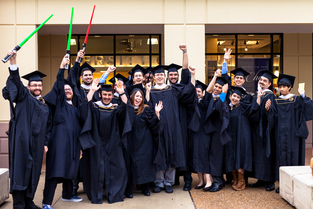 Cohort 11 in their caps and gowns