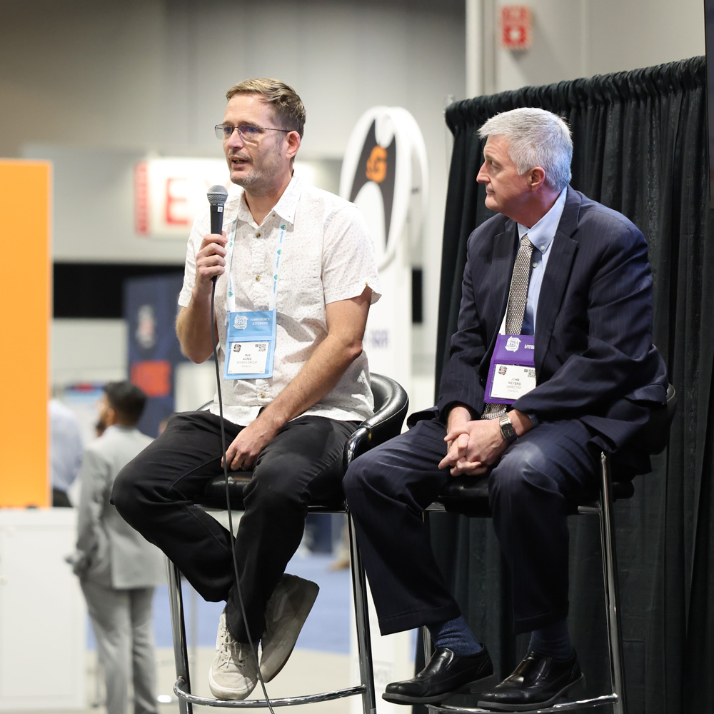 Max Acree speaks to the audience and gives advice to FIEAns